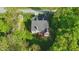 Aerial view of home with a deck surrounded by lush trees at 12065 Gray Eagle Dr, Fishers, IN 46037