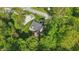 Aerial view of house surrounded by mature green trees at 12065 Gray Eagle Dr, Fishers, IN 46037