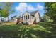 Backyard featuring a deck, mature trees and a well-maintained lawn at 12065 Gray Eagle Dr, Fishers, IN 46037