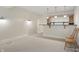 Basement wet bar with overhead lighting and shelving provides a relaxed space for entertaining guests at 12065 Gray Eagle Dr, Fishers, IN 46037