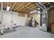 Unfinished basement with exposed ceiling and the home's mechanics, great for storage at 12065 Gray Eagle Dr, Fishers, IN 46037