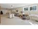 Spacious basement offers multiple tables and open spaces for hobbies, crafts, and creative projects at 12065 Gray Eagle Dr, Fishers, IN 46037