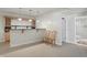 Finished basement with custom bar, wine rack, and two wooden chairs at 12065 Gray Eagle Dr, Fishers, IN 46037