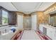 Large bathroom with a soaking tub, double vanity, white cabinets, and tiled floor at 12065 Gray Eagle Dr, Fishers, IN 46037