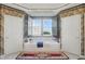 Ensuite bathroom featuring a soaking tub and neutral decor, illuminated by a bright window at 12065 Gray Eagle Dr, Fishers, IN 46037