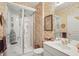 Bathroom featuring a modern shower stall and vanity with ornate wallpaper enhancing the design at 12065 Gray Eagle Dr, Fishers, IN 46037