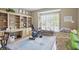Comfortable bedroom with built-in bookshelves and a large window offering ample natural light at 12065 Gray Eagle Dr, Fishers, IN 46037