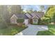 Charming brick home with a well-maintained lawn, mature trees, and an attached two-car garage at 12065 Gray Eagle Dr, Fishers, IN 46037
