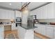 Well-appointed kitchen featuring white cabinets, center island, stainless steel appliances, and great lighting at 12065 Gray Eagle Dr, Fishers, IN 46037