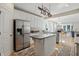 Bright kitchen with white cabinets, stainless steel appliances, and center island perfect for cooking at 12065 Gray Eagle Dr, Fishers, IN 46037