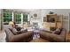Inviting living room featuring a fireplace, plush seating, and large windows for ample natural light at 12065 Gray Eagle Dr, Fishers, IN 46037