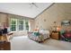 Spacious main bedroom with tall ceilings, large windows, and a ceiling fan at 12065 Gray Eagle Dr, Fishers, IN 46037
