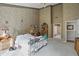 Large primary bedroom with high ceilings, carpet floors, and access to the ensuite bathroom at 12065 Gray Eagle Dr, Fishers, IN 46037