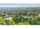 Community pond view surrounded by well-maintained green areas at 12065 Gray Eagle Dr, Fishers, IN 46037