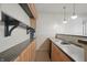 The basement's wet bar offers under-counter cabinets, shelving, a sink, and countertop space for refreshments at 12065 Gray Eagle Dr, Fishers, IN 46037