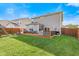 Large backyard with a wooden deck featuring outdoor furniture, a grill, and a play area at 1289 Sunset Blvd, Avon, IN 46123