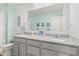 Bright bathroom with granite countertop, double sinks, vanity, and a large mirror at 1289 Sunset Blvd, Avon, IN 46123