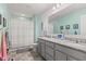 Bright bathroom with granite countertop, double sinks, vanity, and shower with curtain at 1289 Sunset Blvd, Avon, IN 46123