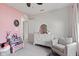 Cozy bedroom featuring a white dresser, comfy chair, and bright, natural light at 1289 Sunset Blvd, Avon, IN 46123