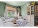 Well-lit bonus room featuring built-in storage, a comfortable sofa, and a bright, cheerful ambiance at 1289 Sunset Blvd, Avon, IN 46123