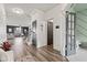 Bright entryway with wood floors, decorative accents, and views of the open living space at 1289 Sunset Blvd, Avon, IN 46123