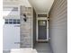Close-up of the front door with stone accents and modern lighting fixtures at 1289 Sunset Blvd, Avon, IN 46123