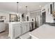 Spacious kitchen with gray cabinets, a large center island, stainless steel appliances, and an open floor plan at 1289 Sunset Blvd, Avon, IN 46123