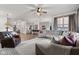 Spacious open concept living room with a large kitchen and a living room area with a sectional couch and arm chairs at 1289 Sunset Blvd, Avon, IN 46123