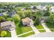 A front aerial view of a 2-story home with a large yard, mature trees, and an attached two car garage at 13131 Conner Knoll Pkwy, Fishers, IN 46038