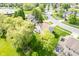 An aerial view of a beautiful home with a large yard, mature trees, and a view of the surrounding neighborhood at 13131 Conner Knoll Pkwy, Fishers, IN 46038
