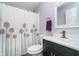 Cozy bathroom featuring a decorative shower curtain, vanity with storage, and a neutral color palette at 13131 Conner Knoll Pkwy, Fishers, IN 46038