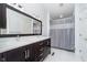 Bright bathroom with dual sinks, modern vanity, and a shower with curtain at 13131 Conner Knoll Pkwy, Fishers, IN 46038