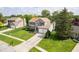 A front aerial view of a 2-story home with brick accents, a 2-car garage, and mature landscaping at 13131 Conner Knoll Pkwy, Fishers, IN 46038