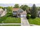 Aerial view of a well-maintained two-story home with a manicured lawn, landscaping, and a spacious driveway at 13131 Conner Knoll Pkwy, Fishers, IN 46038