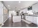 Modern kitchen with white cabinets, stainless steel appliances, a mosaic backsplash, and a central island at 13131 Conner Knoll Pkwy, Fishers, IN 46038