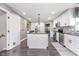 Bright kitchen featuring a central island, stainless steel appliances, and stylish white cabinetry at 13131 Conner Knoll Pkwy, Fishers, IN 46038