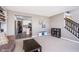 Inviting living room with a staircase, open kitchen, and neutral tones, creating a warm atmosphere at 13131 Conner Knoll Pkwy, Fishers, IN 46038