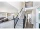 Spacious living room and foyer featuring hardwood floors, large windows, and natural light at 13131 Conner Knoll Pkwy, Fishers, IN 46038