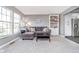 Comfortable living room with a large window, built-in shelving, and plush gray carpeting at 13131 Conner Knoll Pkwy, Fishers, IN 46038