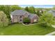 Overhead shot of a well-maintained brick house with manicured lawn and greenery at 13248 Blacktern Way, Carmel, IN 46033
