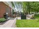 Well-manicured backyard features a large patio with dining and lounge areas at 13248 Blacktern Way, Carmel, IN 46033