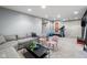 Finished basement area with comfortable seating, workout equipment, and ample space for recreation and relaxation at 13248 Blacktern Way, Carmel, IN 46033