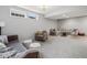 Cozy finished basement features a sectional sofa, armchairs and recessed lighting at 13248 Blacktern Way, Carmel, IN 46033