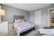 Bright bedroom featuring neutral walls, a comfortable queen bed and stylish decor at 13248 Blacktern Way, Carmel, IN 46033