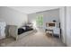 Bedroom with white furniture and neutral walls. Featuring a writing desk with view from the window at 13248 Blacktern Way, Carmel, IN 46033