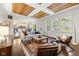Spacious living room with hardwood floors, natural light, and open flow to the kitchen and dining area at 13248 Blacktern Way, Carmel, IN 46033