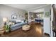 Cozy living room with hardwood floors, stylish decor, and view into the dining area at 13248 Blacktern Way, Carmel, IN 46033
