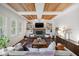 Stylish living room with custom ceiling, fireplace, built-ins, and bright windows at 13248 Blacktern Way, Carmel, IN 46033
