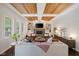 Bright living room featuring modern furnishings, decorative ceiling and large windows, creating an inviting space at 13248 Blacktern Way, Carmel, IN 46033