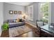 Cozy office space with natural light, hardwood floors, and comfortable seating at 13248 Blacktern Way, Carmel, IN 46033